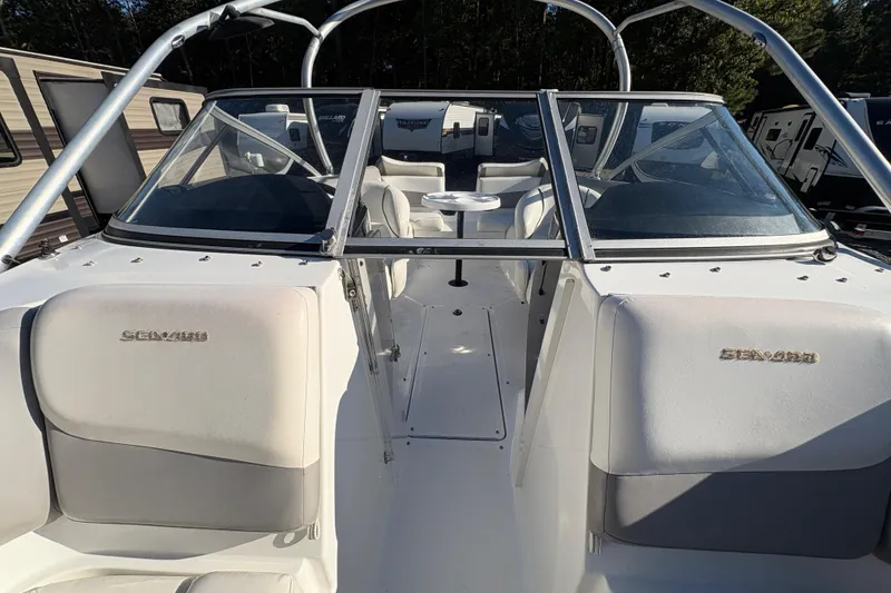 Slide: The Image of 2010 Sea-Doo 210 Challenger SE boat interior with seating and windshield. - 14