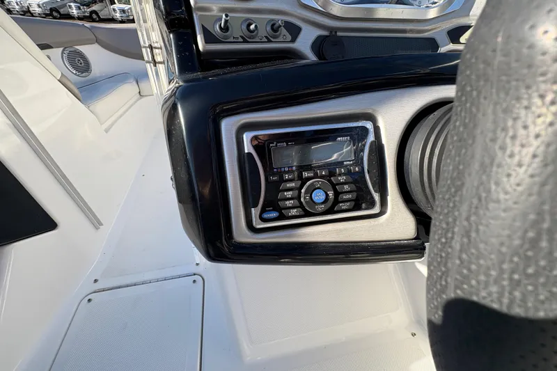 Slide: The Image of 2010 Sea-Doo 210 Challenger SE dashboard with stereo system and control panel. - 16