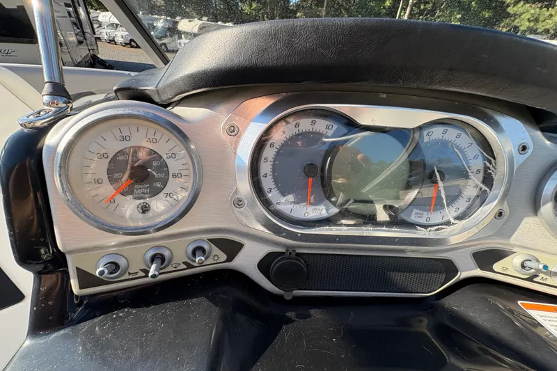 Slide: The Image of Dashboard of 2010 Sea-Doo Sport Boats 210 Challenger SE with speedometer and controls. - 17