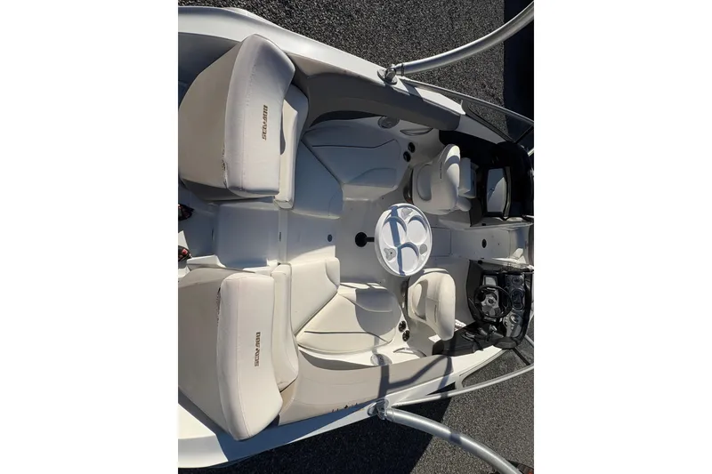 Slide: The Image of 2010 Sea-Doo 210 Challenger SE boat interior with seating and steering console. - 9