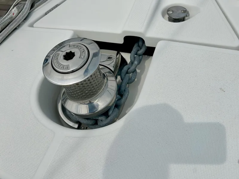 Slide: The Image of Anchor windlass on 2012 Jeanneau 50 DS yacht deck with chain. - 10