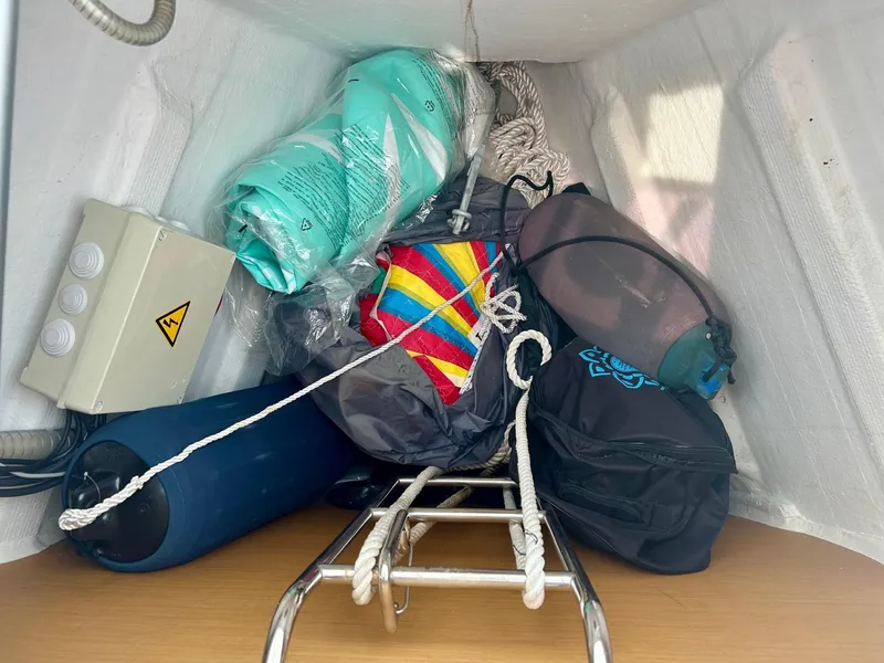 Slide: The Image of Storage compartment on a 2012 Jeanneau 50 DS sailboat with ropes and equipment. - 11