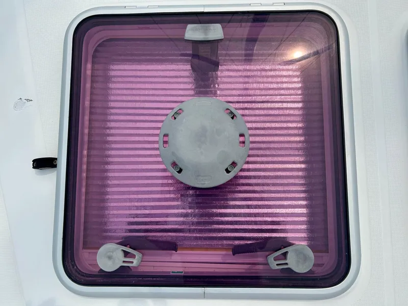 Slide: The Image of Jeanneau 50 DS 2012 hatch with purple tint and locking mechanism. - 13
