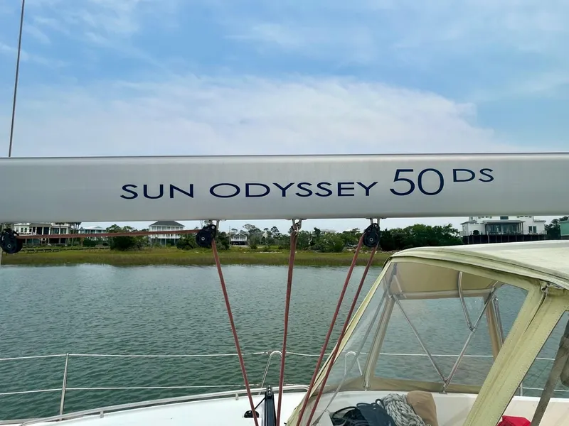 Slide: The Image of Jeanneau Sun Odyssey 50 DS sailboat, 2012 model, docked by the water. - 14