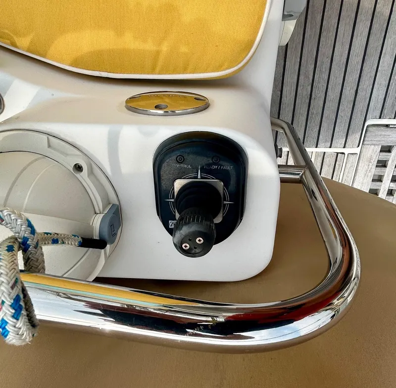 Slide: The Image of Control panel on a 2012 Jeanneau 50 DS yacht with yellow cushion. - 15