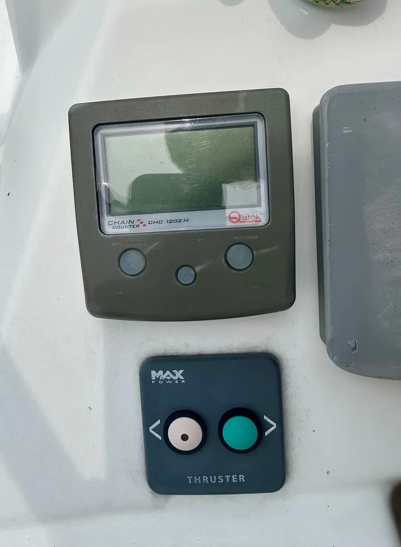 Slide: The Image of Control panel on a 2012 Jeanneau 50 DS sailboat, featuring chain counter and thruster controls. - 16