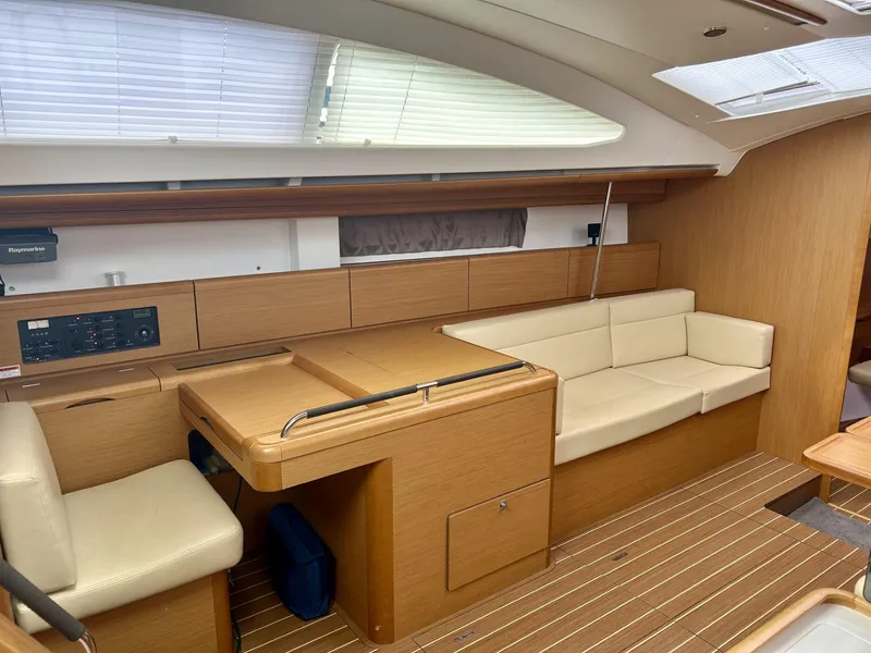 Slide: The Image of Interior of 2012 Jeanneau 50 DS yacht with beige seating and wooden finishes. - 20