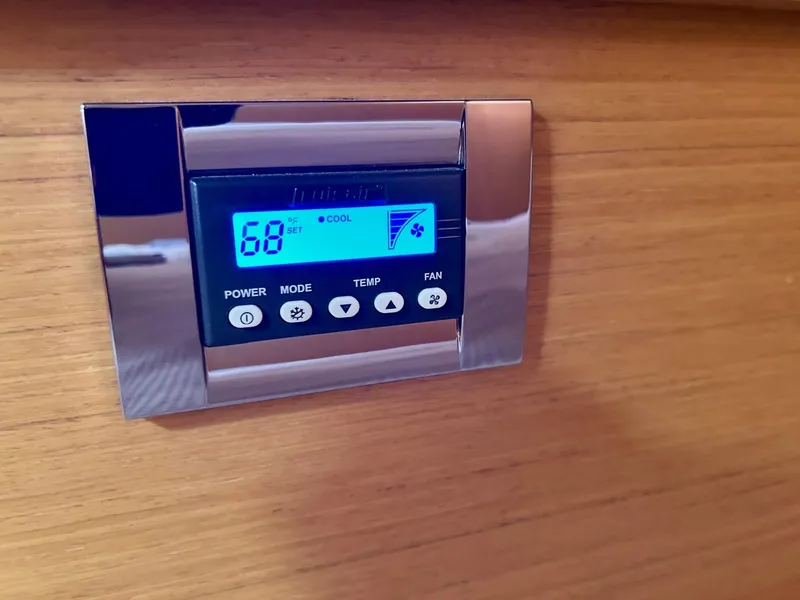 Slide: The Image of Thermostat control panel on Jeanneau 50 DS yacht, 2012 model, displaying 68°F. - 32