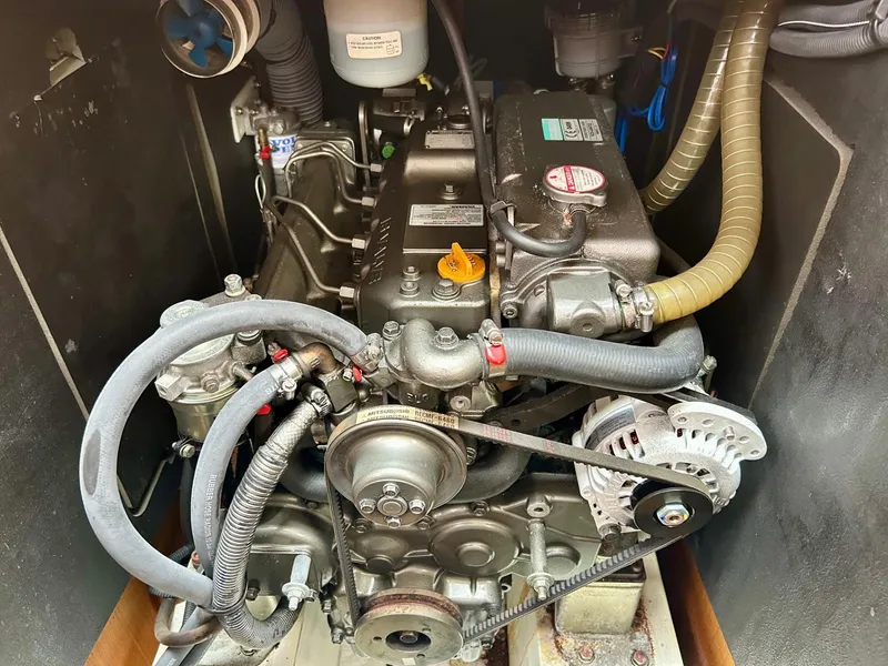 Slide: The Image of Engine compartment of a 2012 Jeanneau 50 DS sailboat, showcasing mechanical components. - 34