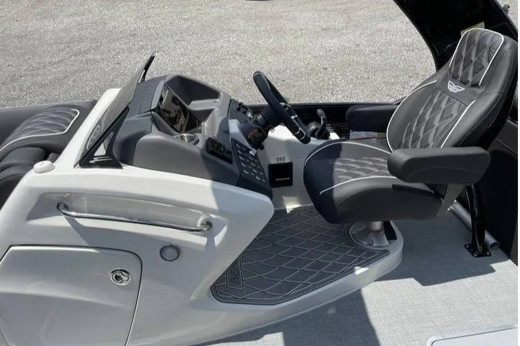 Slide: The Image of 2024 Bennington RFBASR boat interior with sleek helm and luxurious seating. - 5