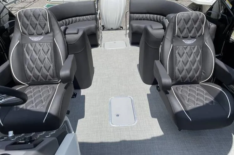 Slide: The Image of 2024 Bennington RFBASR boat interior with luxurious black diamond-stitched seating. - 7