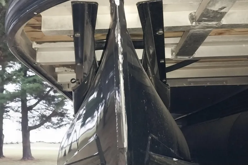 Slide: The Image of 2020 Ranger 2500LS boat hull under trailer, close-up view. - 15