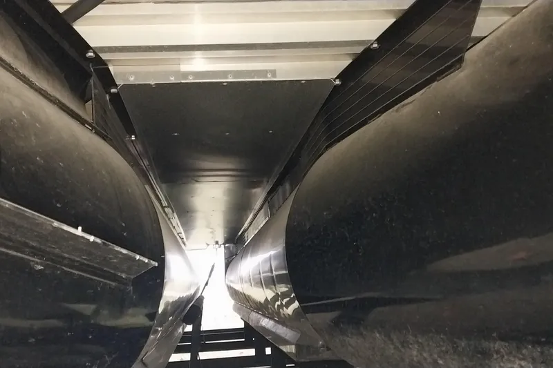 Slide: The Image of Underneath view of a 2020 Ranger 2500LS boat, showcasing pontoons and structural details. - 16