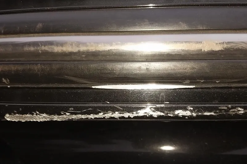 Slide: The Image of Close-up of scratched black surface on 2020 Ranger 2500LS vehicle. - 24