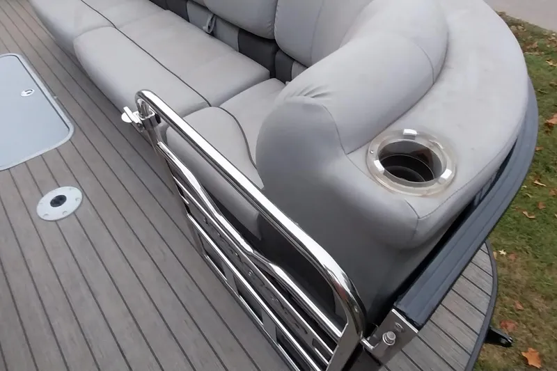 Slide: The Image of Ranger 2500LS 2020 boat interior with gray seating and stainless steel railing. - 34