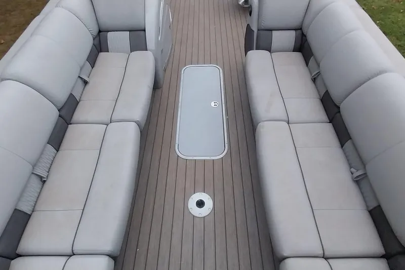 Slide: The Image of Interior of a 2020 Ranger 2500LS boat with gray seating and wooden flooring. - 37