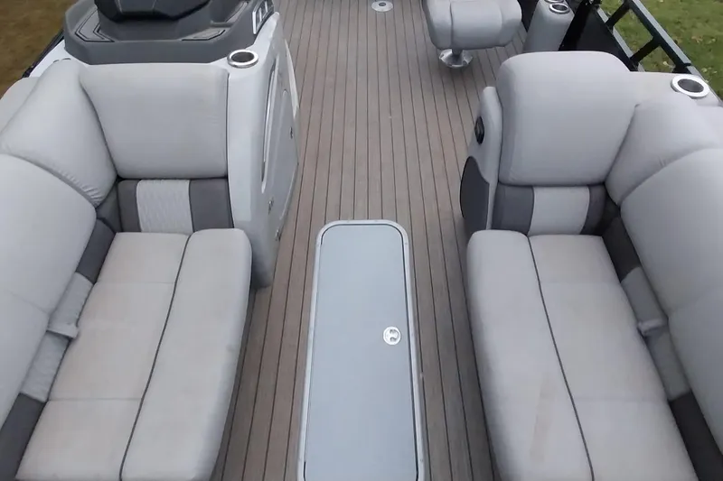 Slide: The Image of Interior of 2020 Ranger 2500LS boat with gray seating and sleek design. - 38