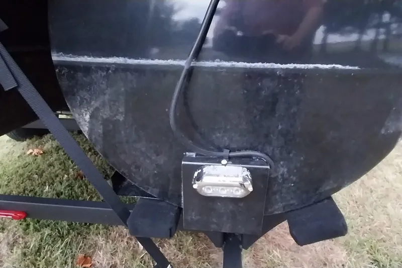 Slide: The Image of Ranger 2500LS 2020 model with black exterior and attached wiring on grassy surface. - 4