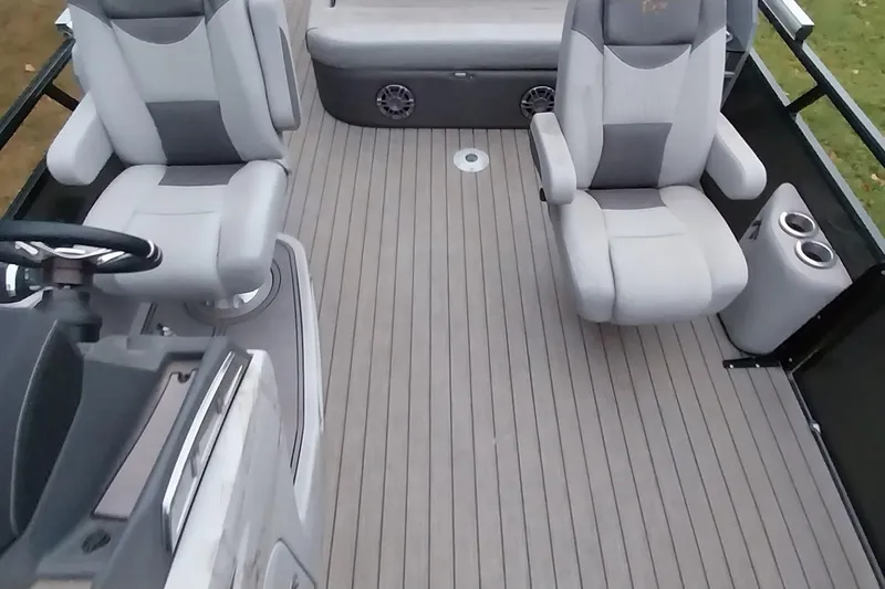 Slide: The Image of 2020 Ranger 2500LS boat interior with gray seating and steering wheel. - 40
