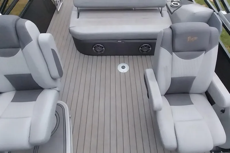 Slide: The Image of 2020 Ranger 2500LS boat interior with gray seating and deck flooring. - 41