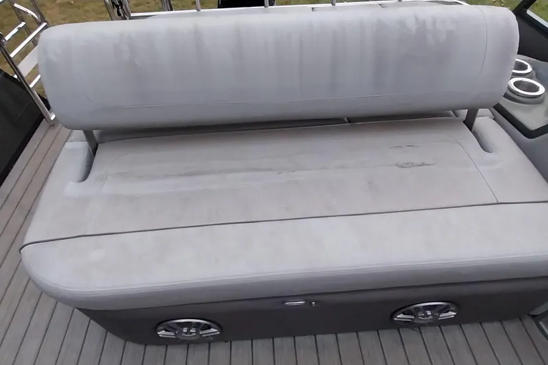 Slide: The Image of 2020 Ranger 2500LS boat seat with cup holders on deck. - 48