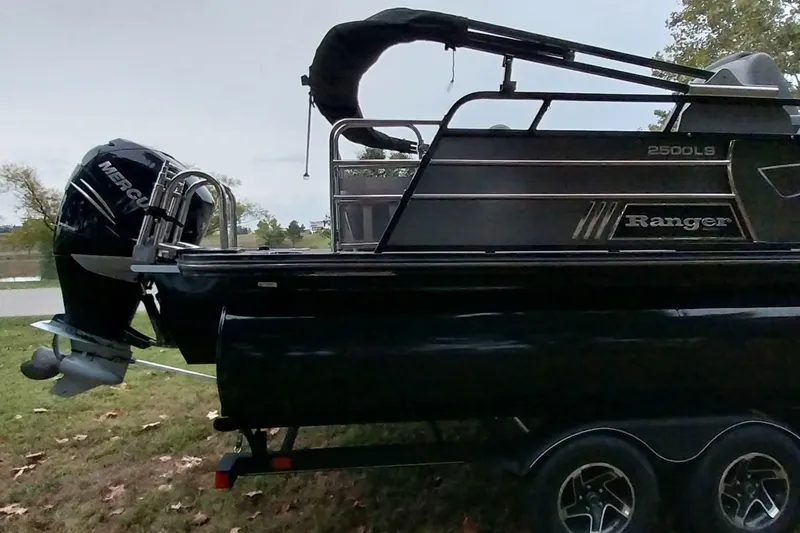 Slide: The Image of 2020 Ranger 2500LS boat with Mercury outboard motor on trailer. - 5