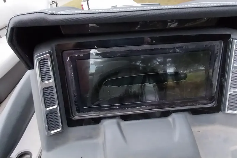 Slide: The Image of Dashboard of a 2020 Ranger 2500LS boat with a central display screen. - 55