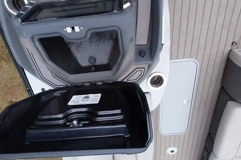 Slide: The Image of Open storage compartment on 2020 Ranger 2500LS boat, showcasing interior details and deck layout. - 58