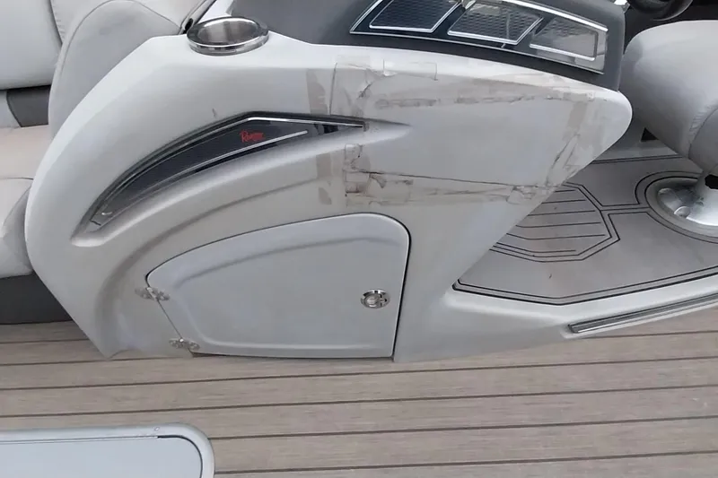 Slide: The Image of Interior of a 2020 Ranger 2500LS boat showing dashboard and seating area. - 59