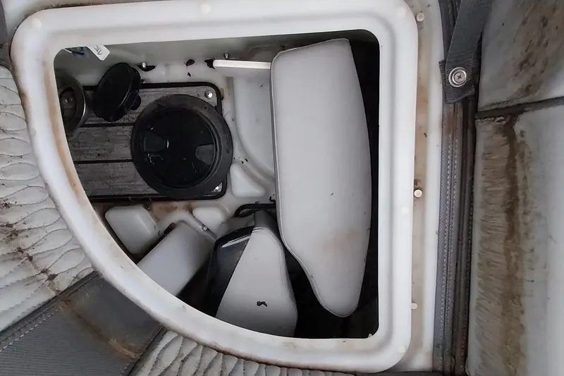 Slide: The Image of Storage compartment in a 2020 Ranger 2500LS boat, featuring various equipment and accessories. - 61