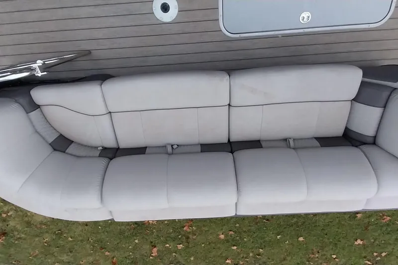 Slide: The Image of Ranger 2500LS 2020 boat with spacious gray seating on deck. - 63