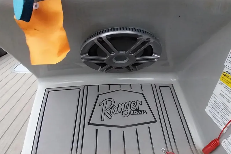 Slide: The Image of 2020 Ranger 2500LS boat interior with speaker and branded flooring. - 67