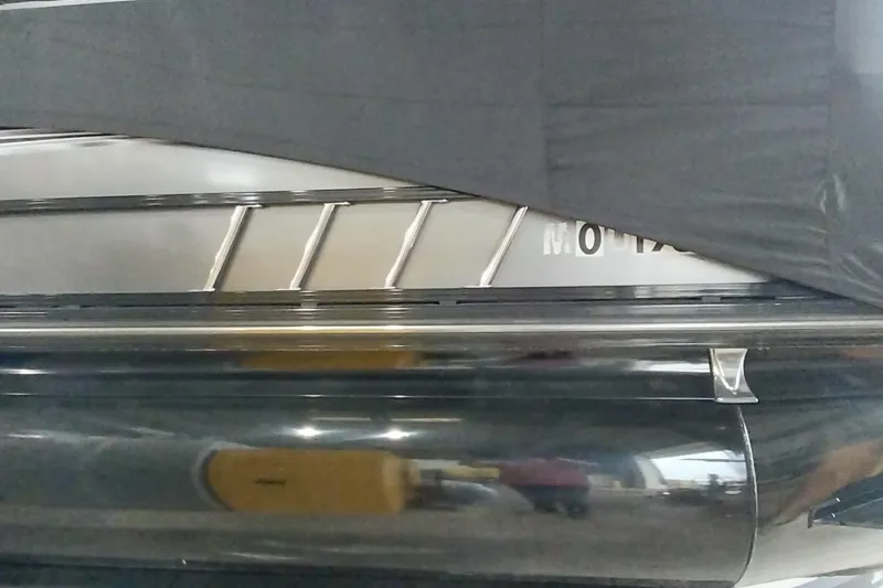 Slide: The Image of 2020 Ranger 2500LS boat partially covered, showcasing sleek design and metallic finish. - 71