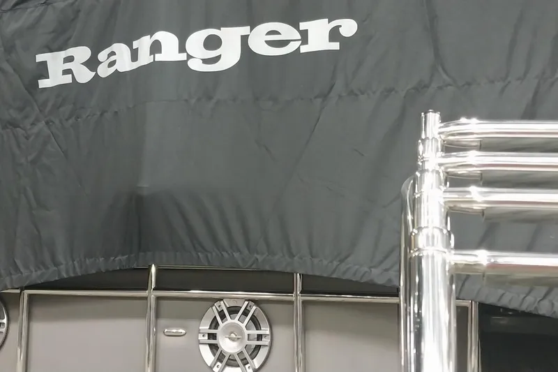 Slide: The Image of 2020 Ranger 2500LS boat with cover and chrome details. - 72