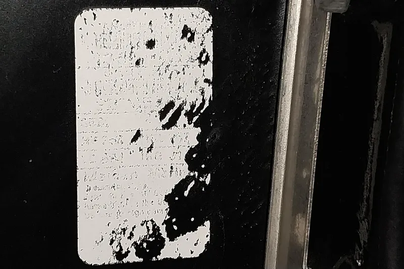 Slide: The Image of Worn label on 2020 Ranger 2500LS, partially obscured text, black and white contrast. - 75