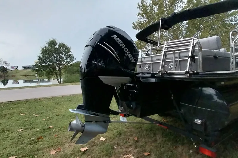 Slide: The Image of 2020 Ranger 2500LS boat with Mercury Verado outboard motor by a lakeside. - 77