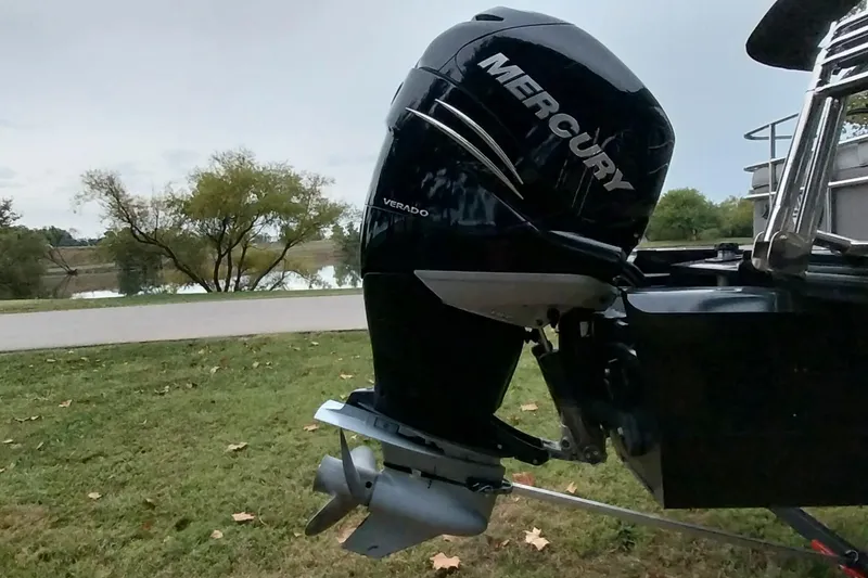 Slide: The Image of 2020 Ranger 2500LS boat with Mercury Verado outboard motor by a lake. - 79