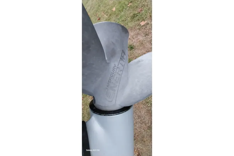 Slide: The Image of Propeller of a 2020 Ranger 2500LS boat with Mercury branding, on grass background. - 81