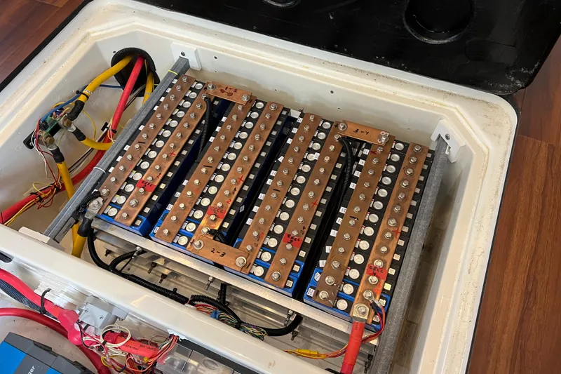 Slide: The Image of Electrical system of a 2019 Aquila 44 yacht, featuring battery chargers and wiring. - 101