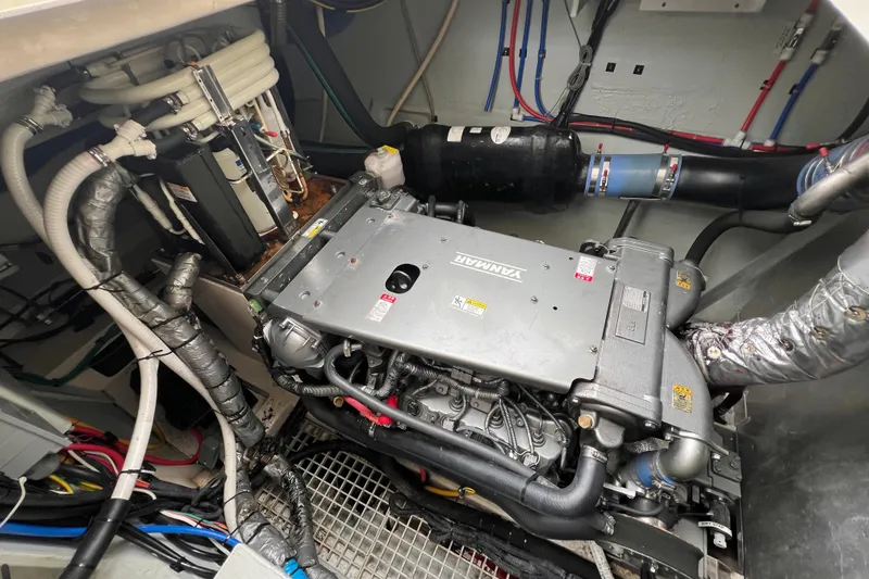 Slide: The Image of Engine room of a 2019 Aquila 44 yacht, showcasing mechanical components and piping. - 110