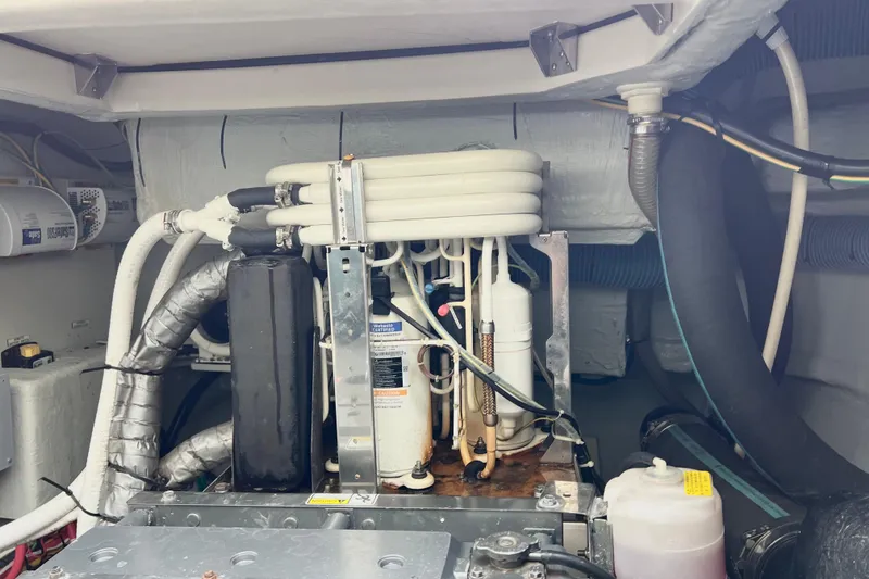 Slide: The Image of Engine room of a 2019 Aquila 44 yacht with Yanmar engine and complex wiring. - 111