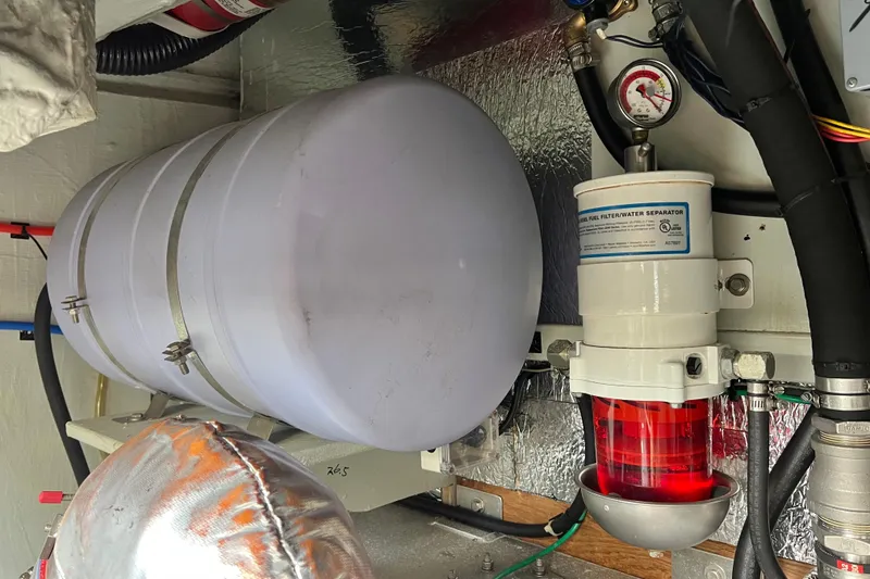 Slide: The Image of Engine room of 2019 Aquila 44 yacht with mechanical components and piping. - 112