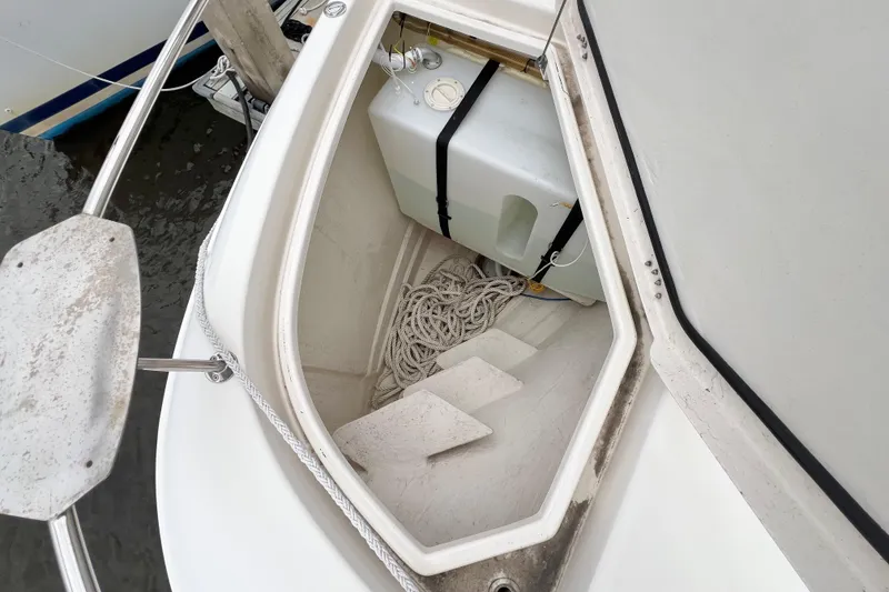 Slide: The Image of Fuel transfer system in a 2019 Aquila 44 boat, showing inspection hatch and connections. - 114