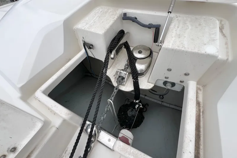 Slide: The Image of Open storage compartments on a 2019 Aquila 44 boat deck, showing ropes and equipment. - 116