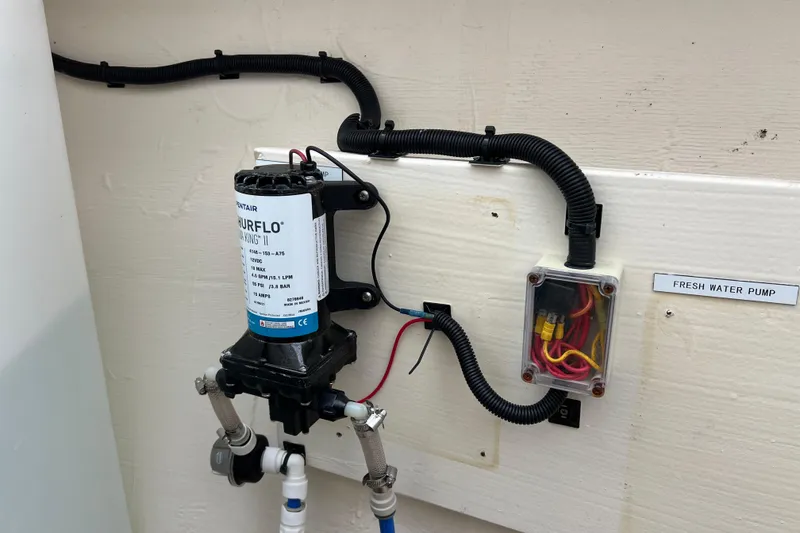 Slide: The Image of Water filtration system in 2019 Aquila 44 boat, featuring Pentair Big Blue filter. - 119