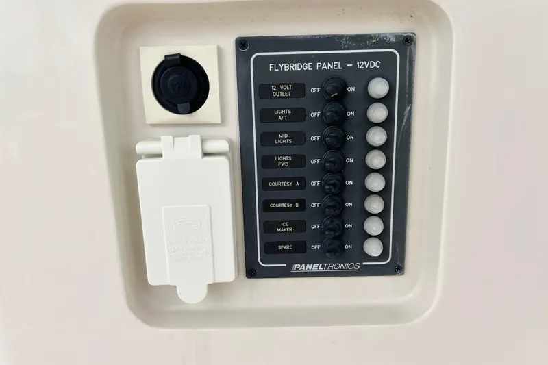 Slide: The Image of Flybridge panel on 2019 Aquila 44 yacht with switches and outlets. - 124