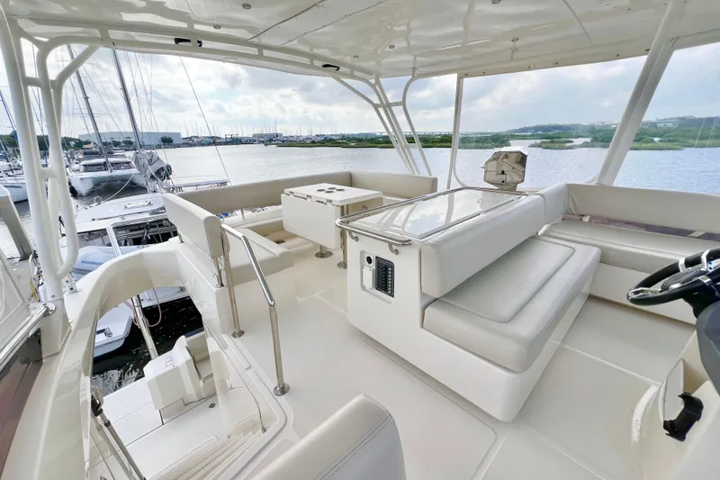 Slide: The Image of Luxurious 2019 Aquila 44 yacht interior with spacious seating and scenic marina view. - 18
