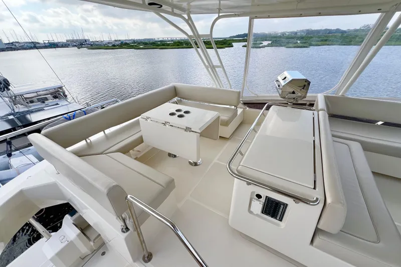 Slide: The Image of Luxurious 2019 Aquila 44 yacht interior with spacious seating and scenic water view. - 20