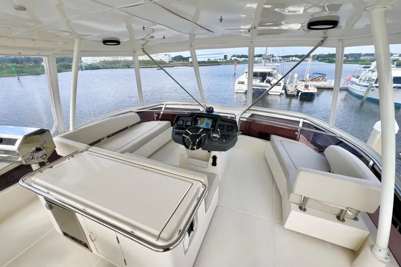 Slide: The Image of Luxurious 2019 Aquila 44 yacht interior with helm, seating, and marina view. - 26
