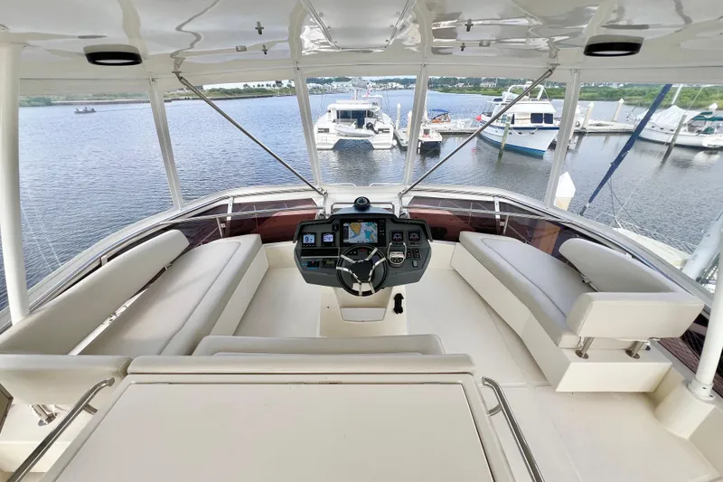 Slide: The Image of Luxurious 2019 Aquila 44 yacht helm with panoramic marina view. - 27